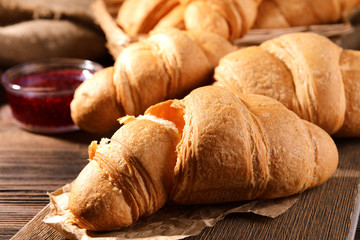 Delicious croissants on table close-up