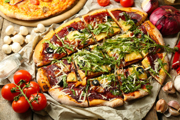 Tasty pizza with vegetables on table close up