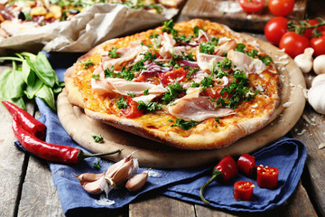 Tasty pizza with vegetables on table close up