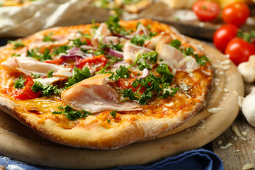 Tasty pizza with vegetables on table close up