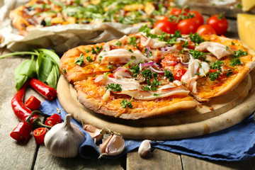 Tasty pizza with vegetables on table close up