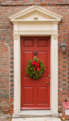 Fototapeta na wymiar Colonial red doorway in historic Elfreth's Alley in Philadelphia