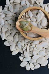 Pumpkin seeds on a black background
