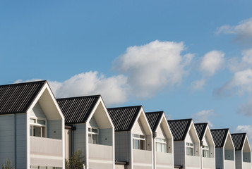 row of new houses with copy space © Patrik Stedrak