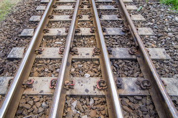 Fototapeta premium railroad tracks with railroad switch, two paths come together