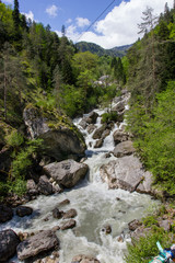 Water rushing by the rocks.
