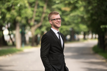 Portrait Of A Confident Businessman Outside In Park