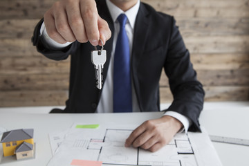 Real estate agent who is held out the key