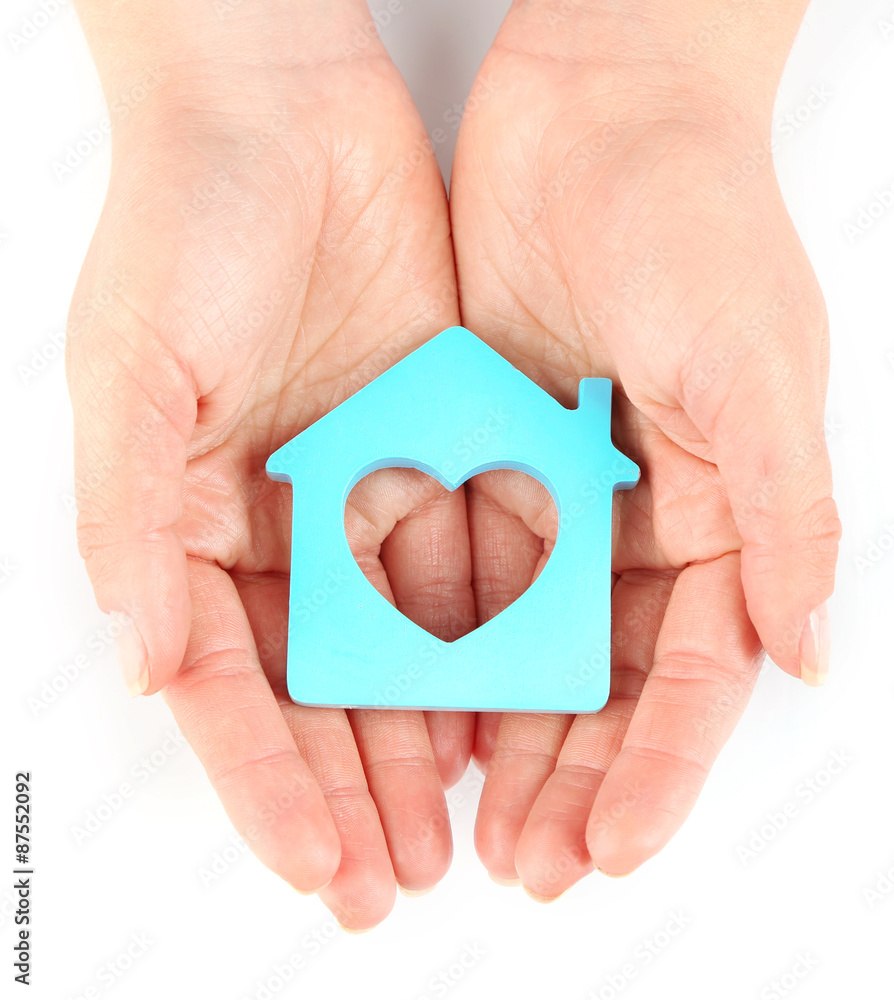 Canvas Prints Female hands with model of house isolated on white