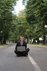 Businessman Working On Tablet Outside The Office