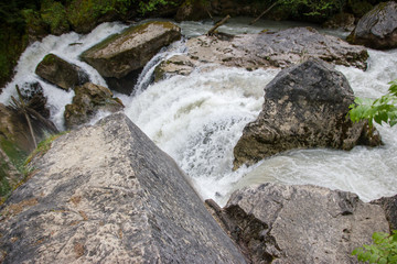 Water rushing by the rocks.