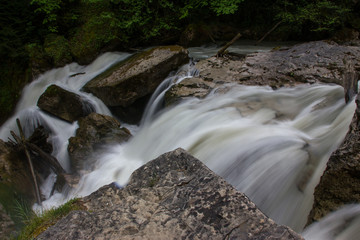 Water rushing by the rocks.