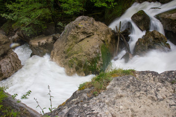 Water rushing by the rocks.