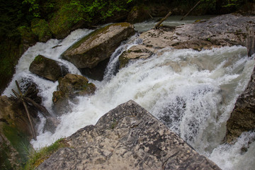 Water rushing by the rocks.