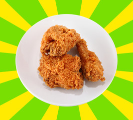 A white plate with fresh, crispy fried chicken