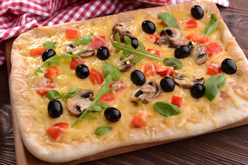 Delicious homemade pizza on table close-up