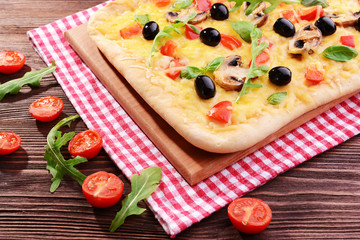 Delicious homemade pizza on table close-up