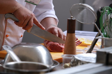 Chef in restaurant kitchen cooking