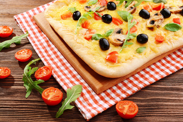 Delicious homemade pizza on table close-up