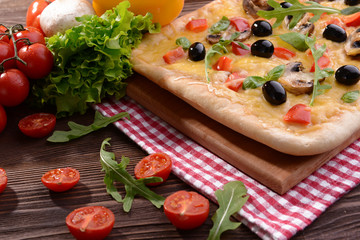 Fototapeta na wymiar Delicious homemade pizza on table close-up