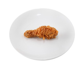 A white plate with fresh, crispy fried chicken