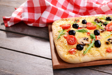 Delicious homemade pizza on table close-up
