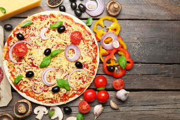 Food ingredients for pizza on table close up