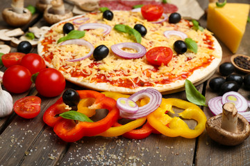 Food ingredients for pizza on table close up