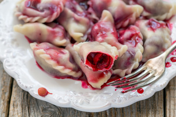 Sweet dumplings with red cherry.