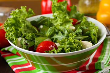 fresh vegetable salad in bowl on table close up