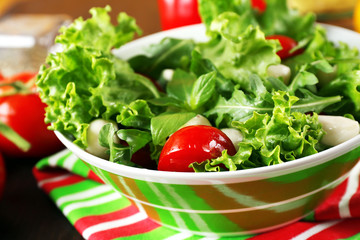 fresh vegetable salad in bowl on table close up