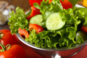 fresh vegetable salad in bowl on table close up