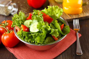fresh vegetable salad in bowl on table close up