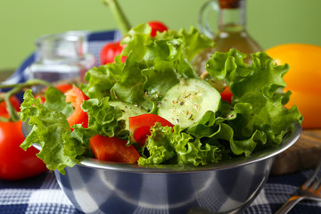 fresh vegetable salad in bowl on table close up