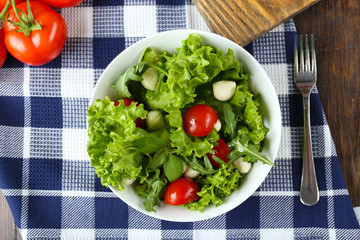 fresh vegetable salad in bowl on table close up