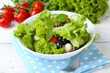 fresh vegetable salad in bowl on table close up