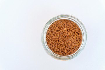 instant coffee in a glass bottle on the white background
