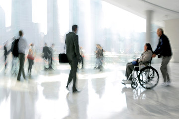 group and disabled people in the lobby business center