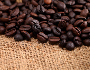 Coffee beans on burlap fabric