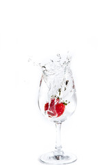 Strawberry in wine glass  on a white background