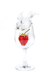 Strawberry in wine glass  on a white background