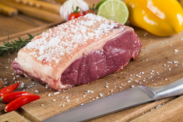 Organic Red Raw Steak Sirloin on wooden board