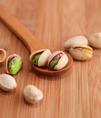 Pistachio nut on wood background