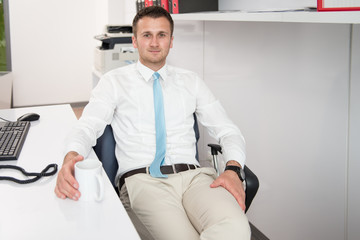 Handsome Young Businessman Portrait In His Office