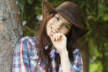 young girl in a cowboy hat