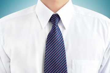 A man wearing white shirt and tie