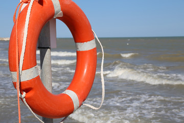 Orange jackets with rope to rescue swimmers in the sea in summer