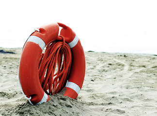 Orange jackets with rope to rescue swimmers in the sea in summer