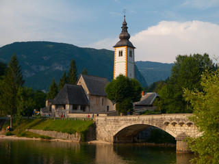 Church tower and stone bridge at Lake Bohinj