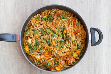 Vegan spaghetti with tofu and pepper delicious on pan from above